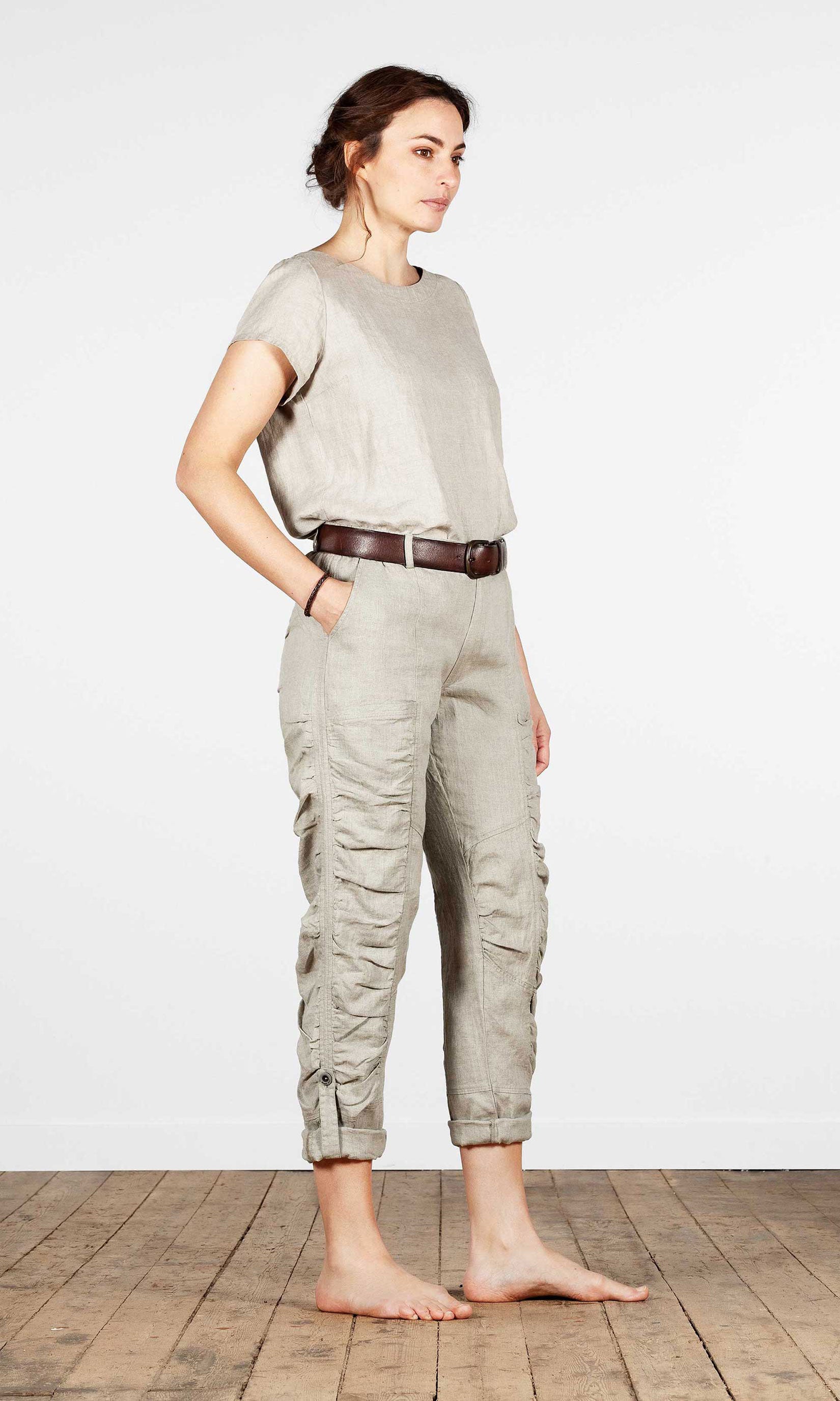 Linen trousers with pleats and strap on the leg